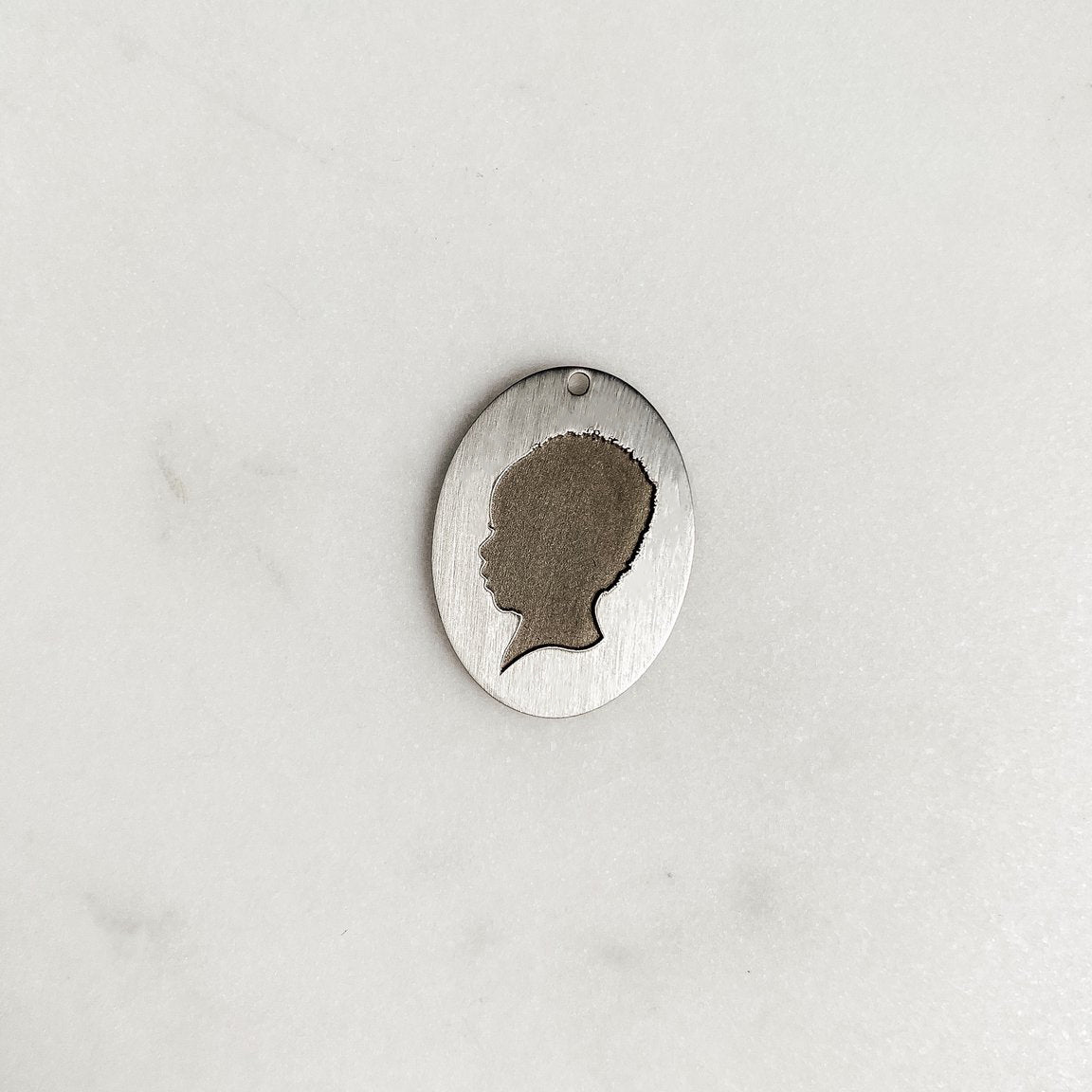 The *Statement* Silhouette Coin Charm
